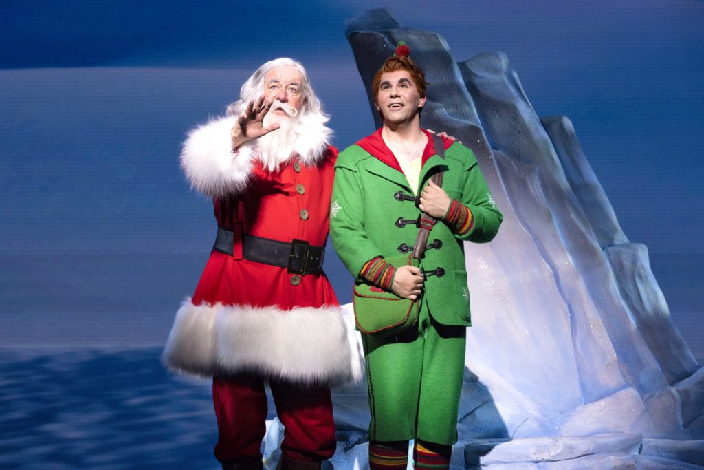 LtoR Nicholas Pound as Santa & Simon Lipkin as Buddy in Elf The Musical, credit Mark Senior
